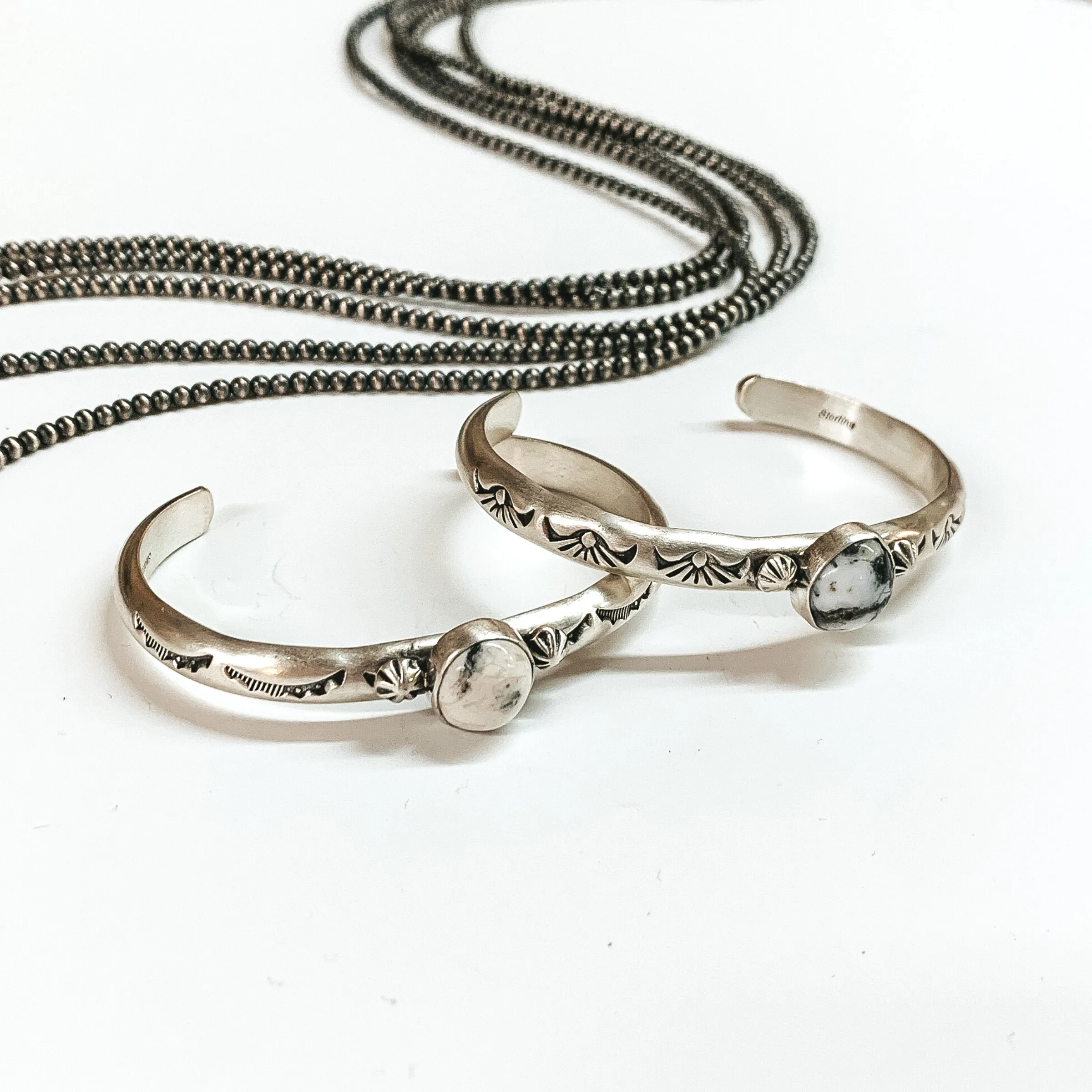 Navajo | Navajo Handmade Detailed Sterling Silver Cuff with Center White Buffalo Stone
