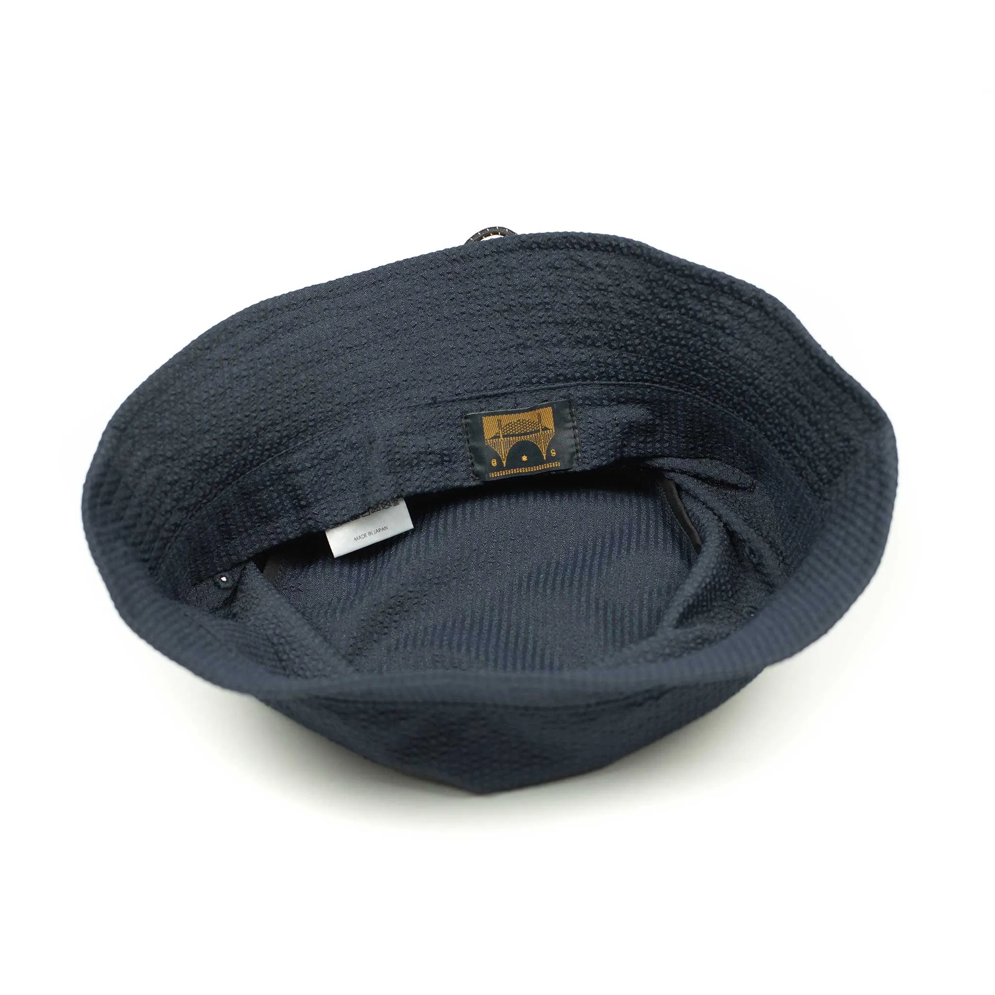 Storage loop bucket hat in tonal navy blue CoolMax seersucker
